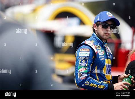 NASCAR Driver Chase Elliott Looks On After Qualifying First For Sunday