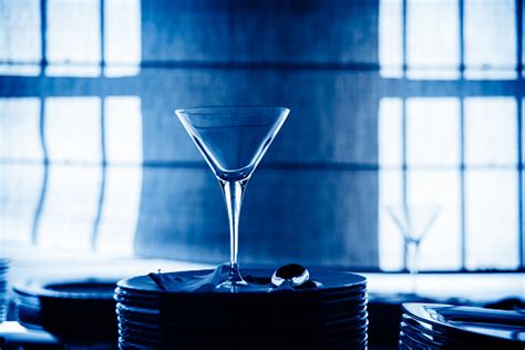 Empty Glass Cup With Sun Flares Background In A Restaurant Stock Photo