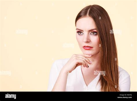 Pensive Attractive Brunette Woman With Full Makeup Having Serious Thinking Face Expression