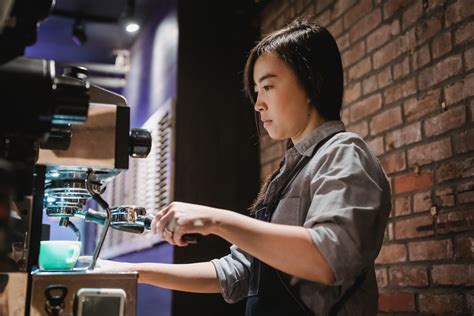 Barista Using Coffee Machine · Free Stock Photo