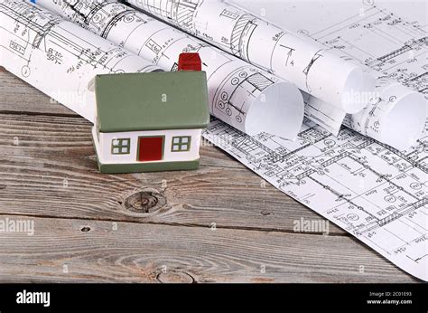 Projects of houses with model of a house Stock Photo - Alamy