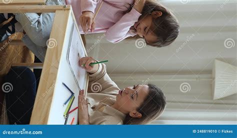 Loving Mom and Daughter Talking Drawing with Colored Pencils Indoor ...