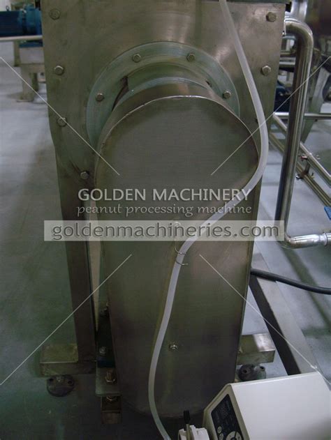 A Machine That Is Working On Some Kind Of Machinery In A Factory Or