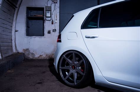 White Vw Golf Resting On Charcoal Gray Jr Wheels — Gallery