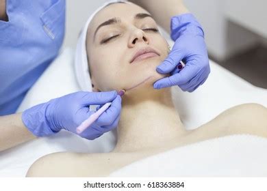 Beautician Touch Draw Correction Lines On Stock Photo