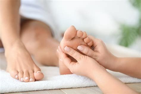 Beautiful Young Woman Receiving Foot Massage In Spa Salon Stock Image Image Of Oriental