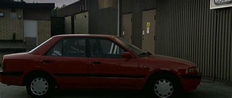 IMCDb Org 1993 Mazda 323 1 6i BG In Fyra Nyanser Av Brunt 2004