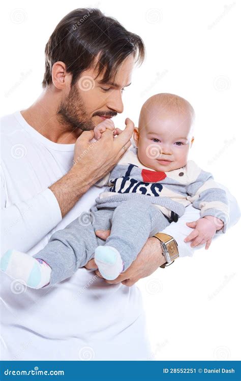 Young Father Cradling His Baby On His Arm Stock Image - Image: 28552251