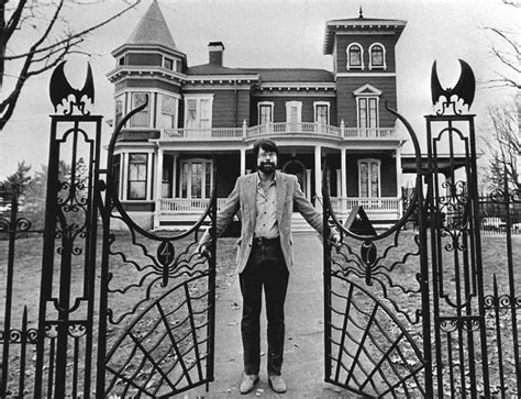 Stephen King Standing At The Gate Of His House In Bangor Maine