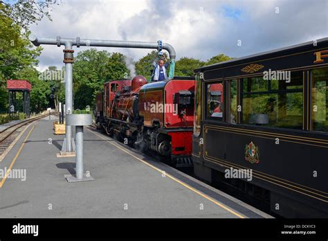 Welsh Highland Railway Steam Train Taking Water At Beddgelert Station