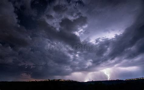 Beautiful Thunderstorm With Clouds And Lightning Over The Night City