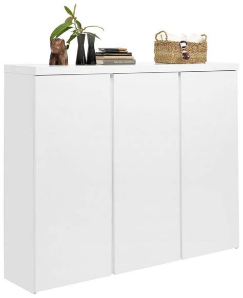 A White Cabinet With Three Doors And Two Baskets On The Top Next To A