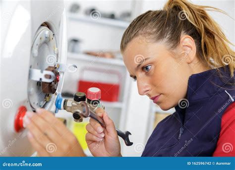 Female Technician Servicing Boiler Stock Photo Image Of Head