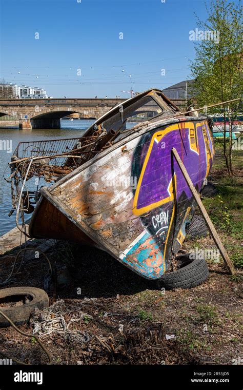 Abandoned Dilapidated And Graffiti Covered Old Wooden Boat Rotting At