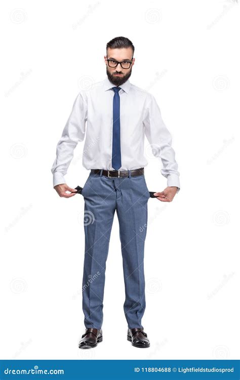 handsome poor businessman  empty pockets stock photo image