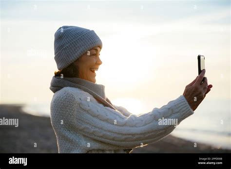 Happy Mature Woman Taking Selfie Through Smart Phone Stock Photo Alamy