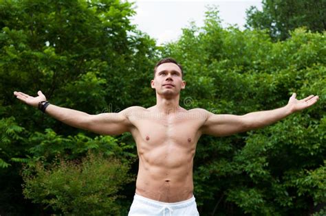 Man With A Naked Torso Stands With His Hands Up Stock Photo Image Of