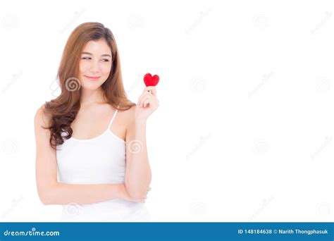 Portrait Of Beautiful Asian Young Woman Holding Red Heart Shape Pillow