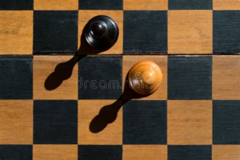 Top View Chess Pawns Stand On Chess Board With Shadows Stock Photo