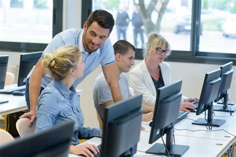 Teacher and Students in Classroom Stock Photo - Image of studying ...