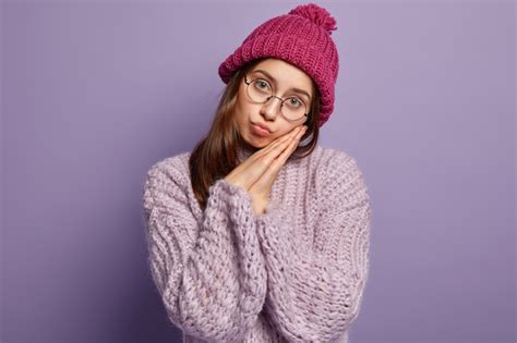 Free Photo Young Woman Wearing Purple Sweater And Hat