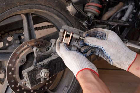 The Process Of Replacing Brake Pads On A Motorcycle Stock Image Image