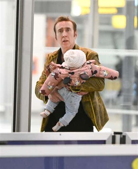 Nicolas Cage Grins As He Carries Seven Month Old Daughter With