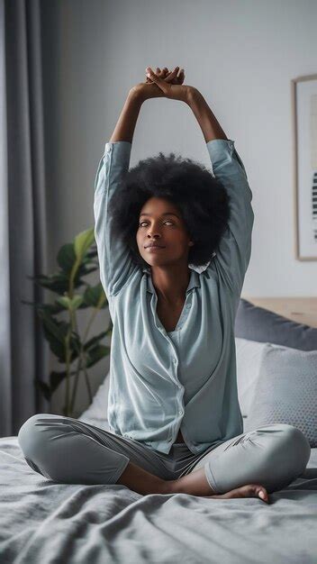 Black Woman Morning Stretching And Waking Up In Home Bedroom After