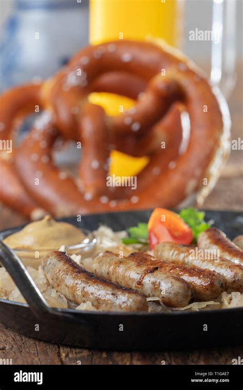 Grilled Nuremberger Bratwurst With Sauerkraut Stock Photo Alamy