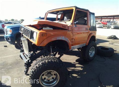 Orange Suzuki Samurai Lifted