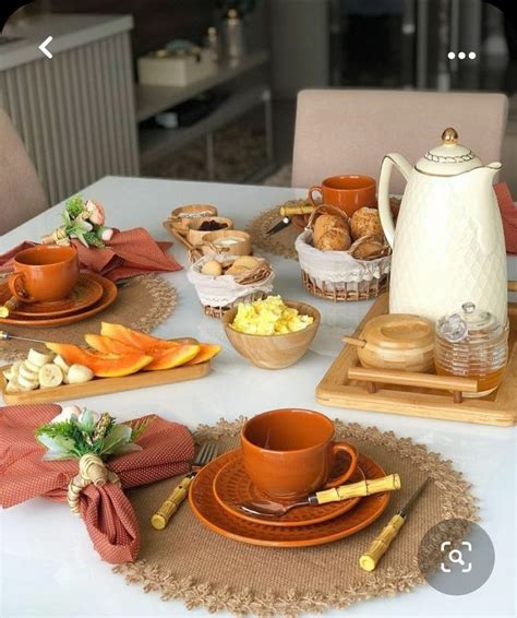 The Table Is Set With Dishes Cups And Saucers For Tea Or Desserts