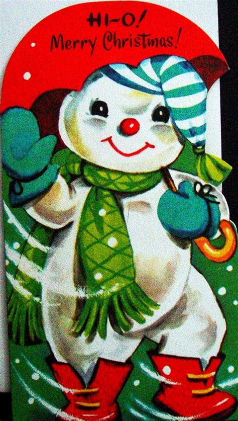 A Christmas Card With A Snowman Holding An Umbrella