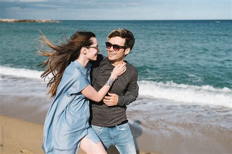 Young Couple Enjoying The Sea By Stocksy Contributor Simone Wave