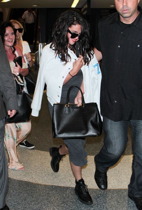 Selena Gomez At Lax Airport April 2015 • Celebmafia