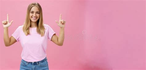 Indoor Shot Of Pleasant Attractive Friendly Looking Girl With Tanned Skin In Casual T Shirt And