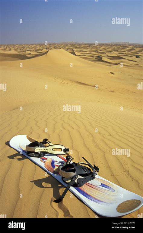 Sandboarding, Desert Dubai, United Arabic Emirates Stock Photo - Alamy