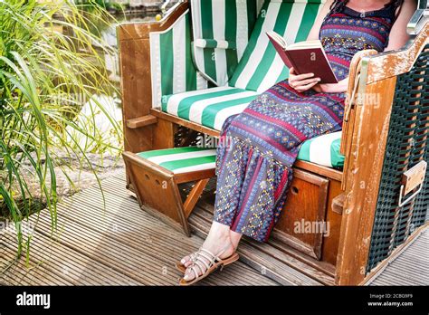 Woman Relaxing In Deck Chair Hi Res Stock Photography And Images Alamy