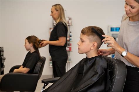 Free Photo High Angle Kid Getting Haircut At Salon