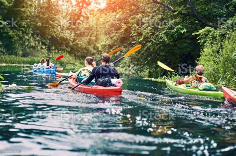 group of young people on kayak outing rafting down the river - Cape ...