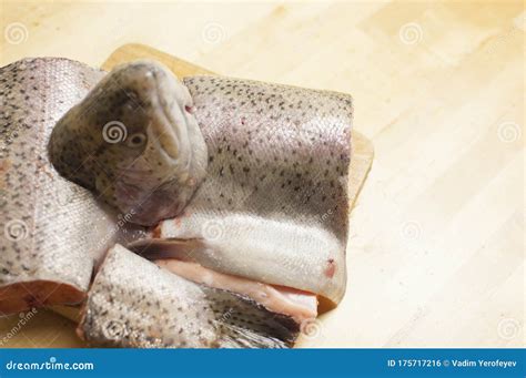 Pieces Of Fresh Trout Fish On A Wooden Surface Stock Photo Image Of