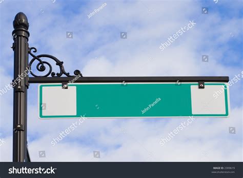 A Green Street Sign On A Decorative Wrought Iron Post Stock Photo ...