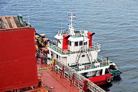 Various Views Of Vessels And Tugboats In Port Close Up View Of The