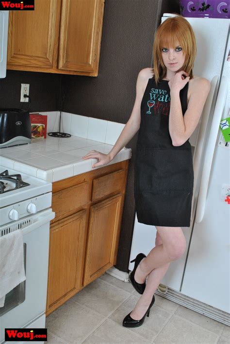 Hot Skinny Amateur Babe Poses In The Kitchen In Her Apron Photos