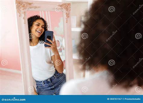 Happy Latin Woman Taking Selfie In Mirror Stock Image Image Of Outfit