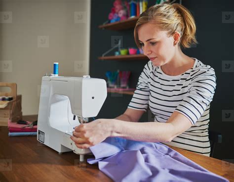 Woman Sewing On Sewing Machine Photo 140150 Youworkforthem