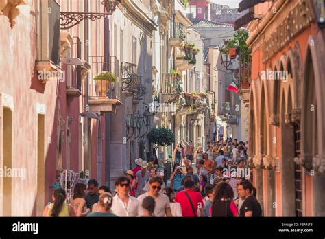 Taormina Sicily People View Of Tourists In Summer Walking In The Corso