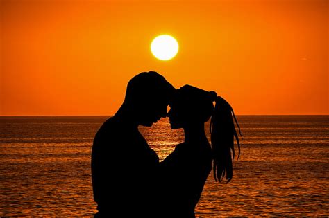 Royalty Free Photo Man And Woman Hugging By The Beach With Ocean On