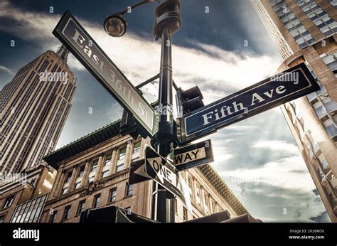 Fifth Ave 5th Ave, New York City sign, view from low angle with sunset ...