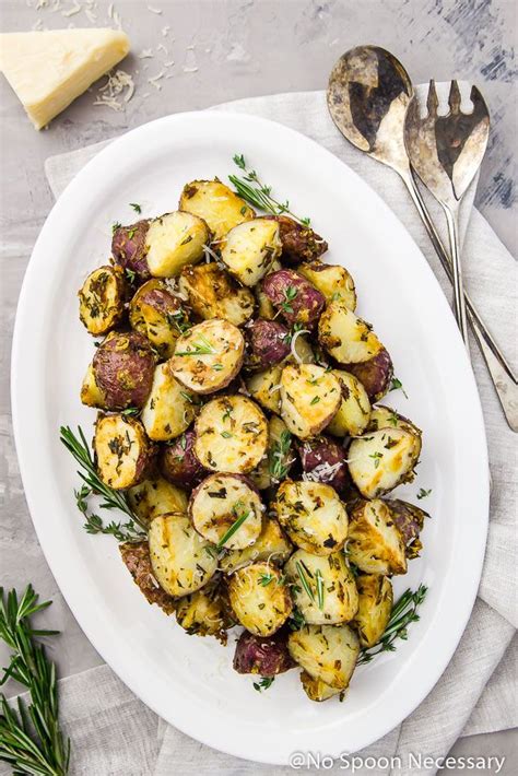 Overhead Shot Of Asiago Garlic Herb Roasted Red Potatoes On A White