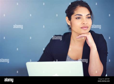 Dreaming Up New Business Ideas A Young Businesswoman Looking